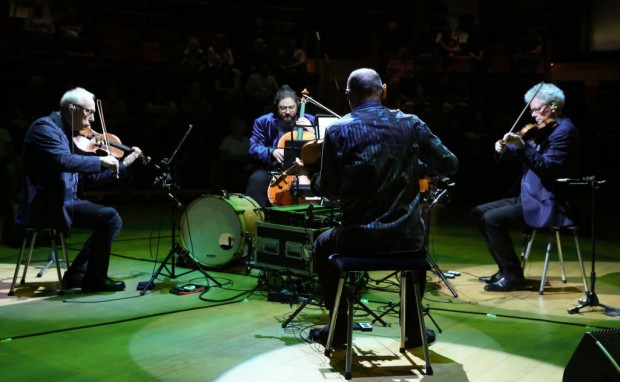 BERLIN, GERMANY - MAY 21: (L to R) Hank Dutt, Paul Wiancko, John Sherba and David Herrington of the Kronos Quartet perform in the Pierre Boulez Saal during an open house at the Barenboim-Said Akademie on May 21, 2023 in Berlin, Germany. The musical educational institution co-founded by the conductor and pianist Daniel Barenboim and the literary theorist Edward Said opened in 2016 and allowed visitors to see its facilities and hear its students, as well as the Kronos Quartet string ensemble, perform a program featuring selections from the latter's 50th anniversary album after that group held a one-week residency at the academy. 