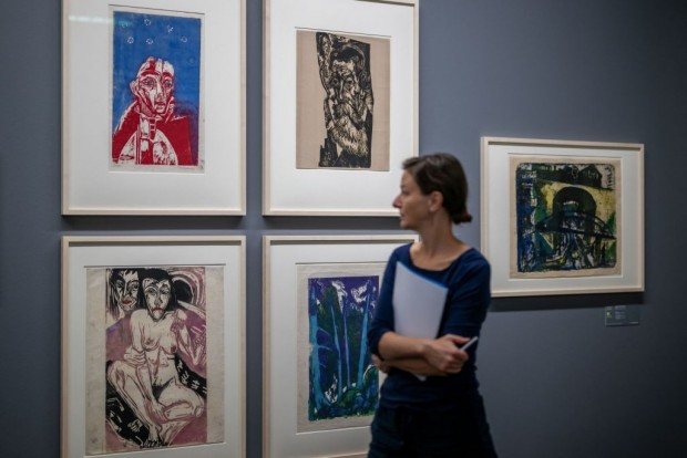 A woman looks at works by Ernst Ludwig Kirchner during a press preview ahead of the public opening of the exhibition 