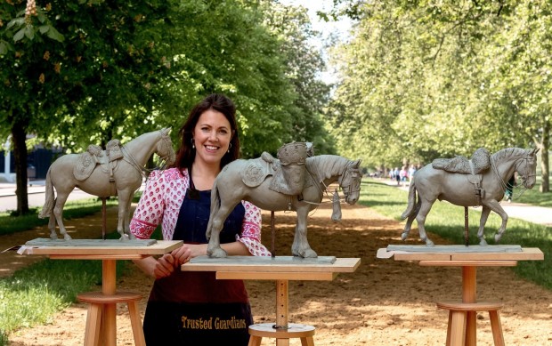 Zoë Carmichael, with her three sculptures commissioned by the Household Cavalry Mounted Regiment