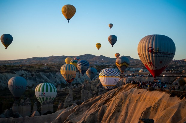 10/22/2023 Cappadocia , Turkey. Hot air balloons gracefully drift over Cappadocia during the autumn season in Nevsehir, Turkey. This daily spectacle provides a bird's-eye view of the region, a UNESCO World Cultural Heritage site celebrated for its natural, historical, and cultural richness. Cappadocia, a popular tourist destination in central Turkey, is renowned for its volcanic landscapes and iconic hot air balloon rides, capturing the scene on October 22.