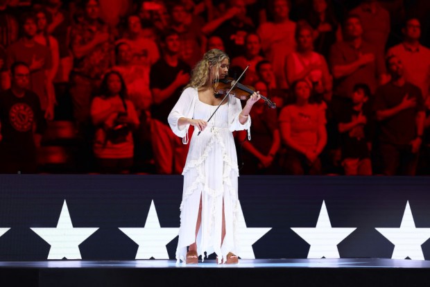 INDIANAPOLIS, INDIANA - JUNE 22: Elizabeth Beisel performs the National Anthem on Day Eight of the 2024 U.S. Olympic Team Swimming Trials at Lucas Oil Stadium on June 22, 2024 in Indianapolis, Indiana. 